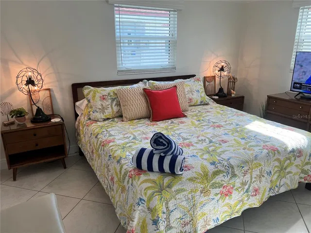 a bedroom with a bed and dresser