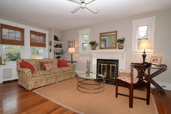 11 Hardy Road Wellesley, MA 02482 - Photo 3 of 20 a living room with furniture and a fireplace