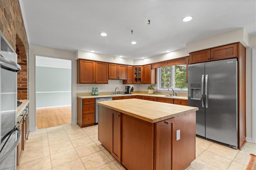 2603 Glenchester Road Wexford, PA 15090 - Photo 12 of 45 a kitchen with stainless steel appliances granite countertop refrigerator sink and cabinets