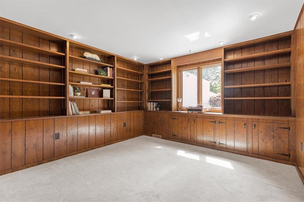 2603 Glenchester Road Wexford, PA 15090 - Photo 22 of 45 a view of an empty room with wooden shelves and a window