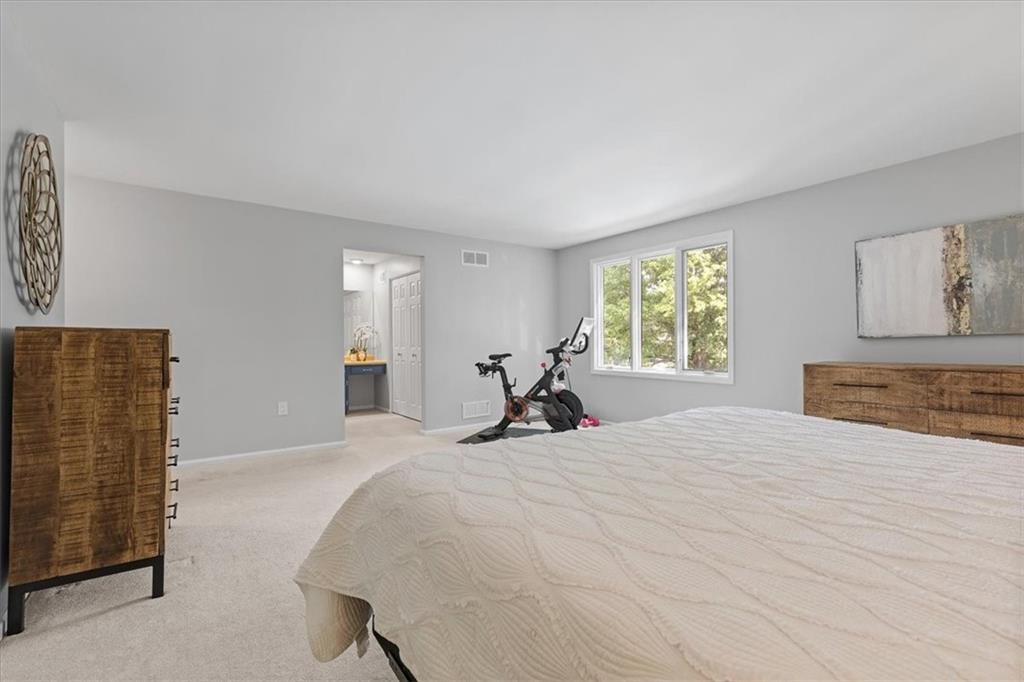 2603 Glenchester Road Wexford, PA 15090 - Photo 25 of 45 a bed room with a bed and a flat tv screen on dresser