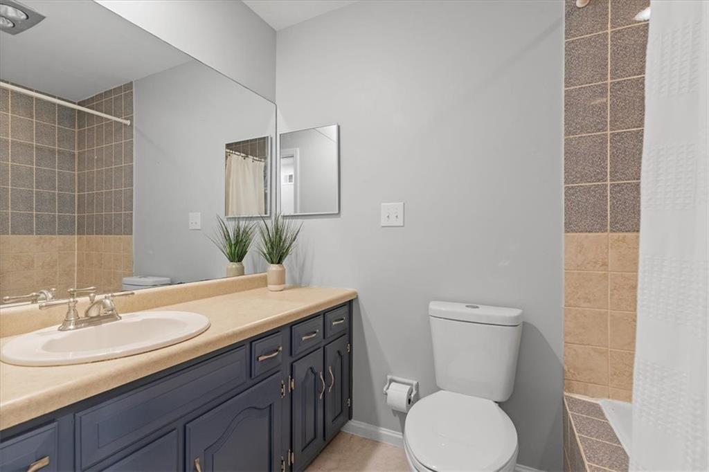 2603 Glenchester Road Wexford, PA 15090 - Photo 28 of 45 a bathroom with a granite countertop toilet sink and mirror