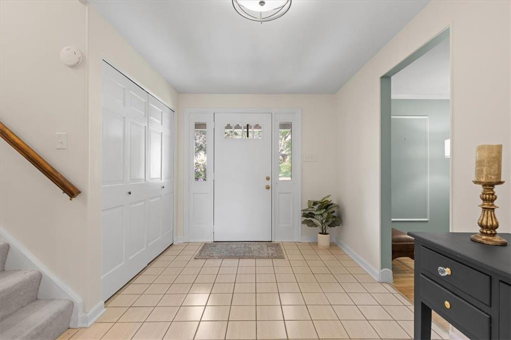 2603 Glenchester Road Wexford, PA 15090 - Photo 3 of 45 a view of a hallway to a livingroom with wooden floor and furniture