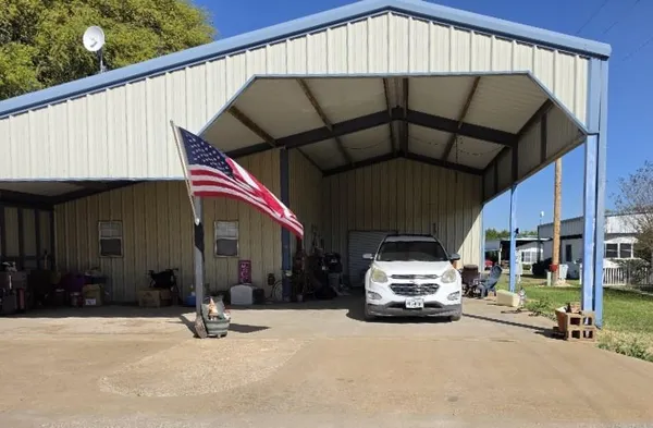 a car parked in front of a house