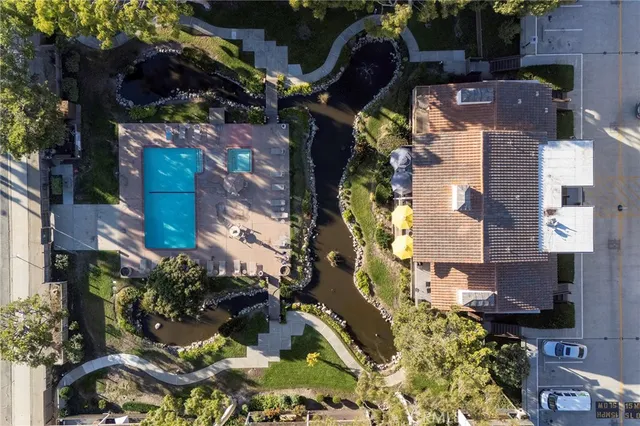 an aerial view of residential houses with outdoor space