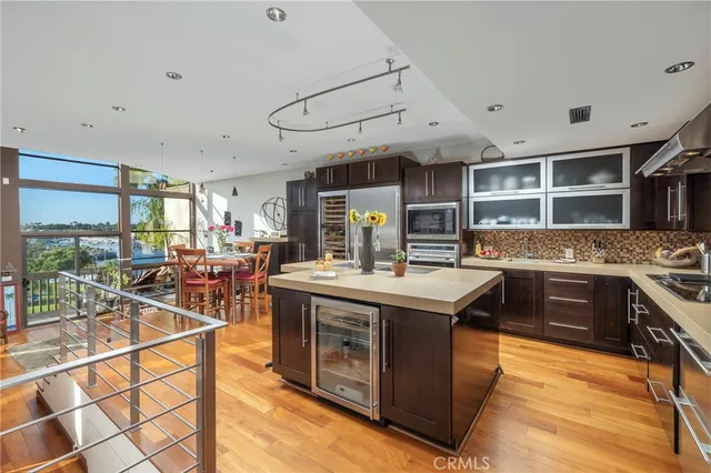 a kitchen with stainless steel appliances granite countertop a stove and a sink
