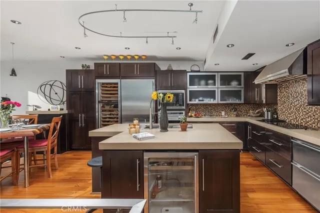 a kitchen with a table and chairs in it