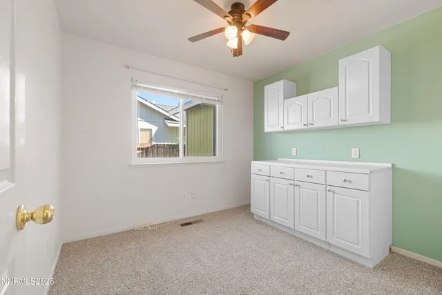 a room with cabinets and a window
