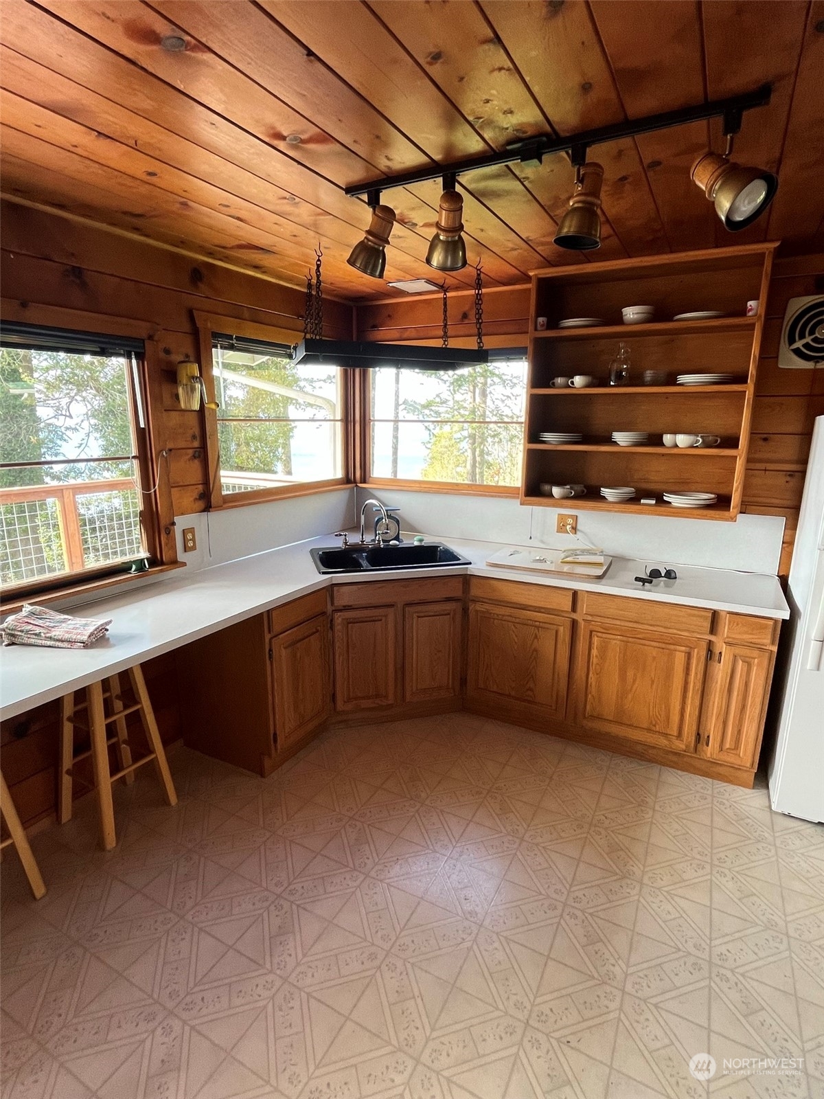509 Spring Street Camano Island, WA 98282 - Photo 11 of 28 a kitchen with a stove and a sink