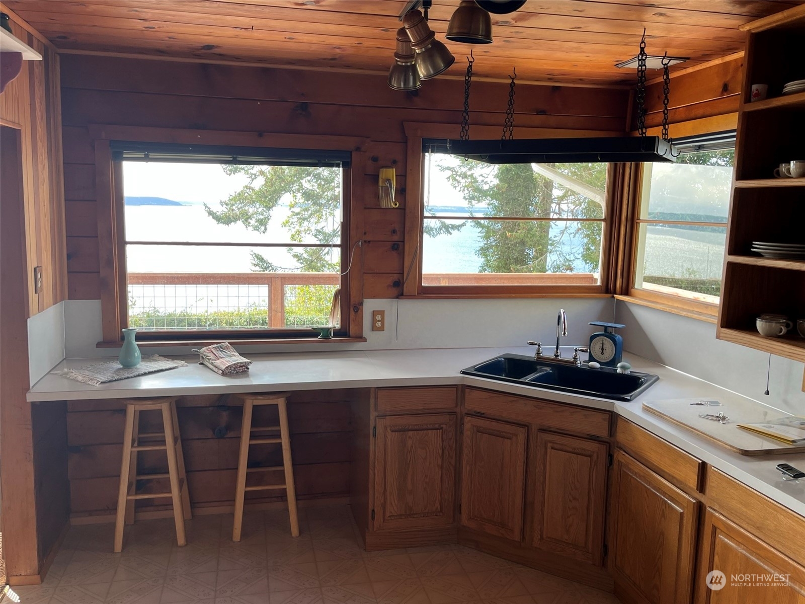 509 Spring Street Camano Island, WA 98282 - Photo 13 of 28 a kitchen with a sink and large window