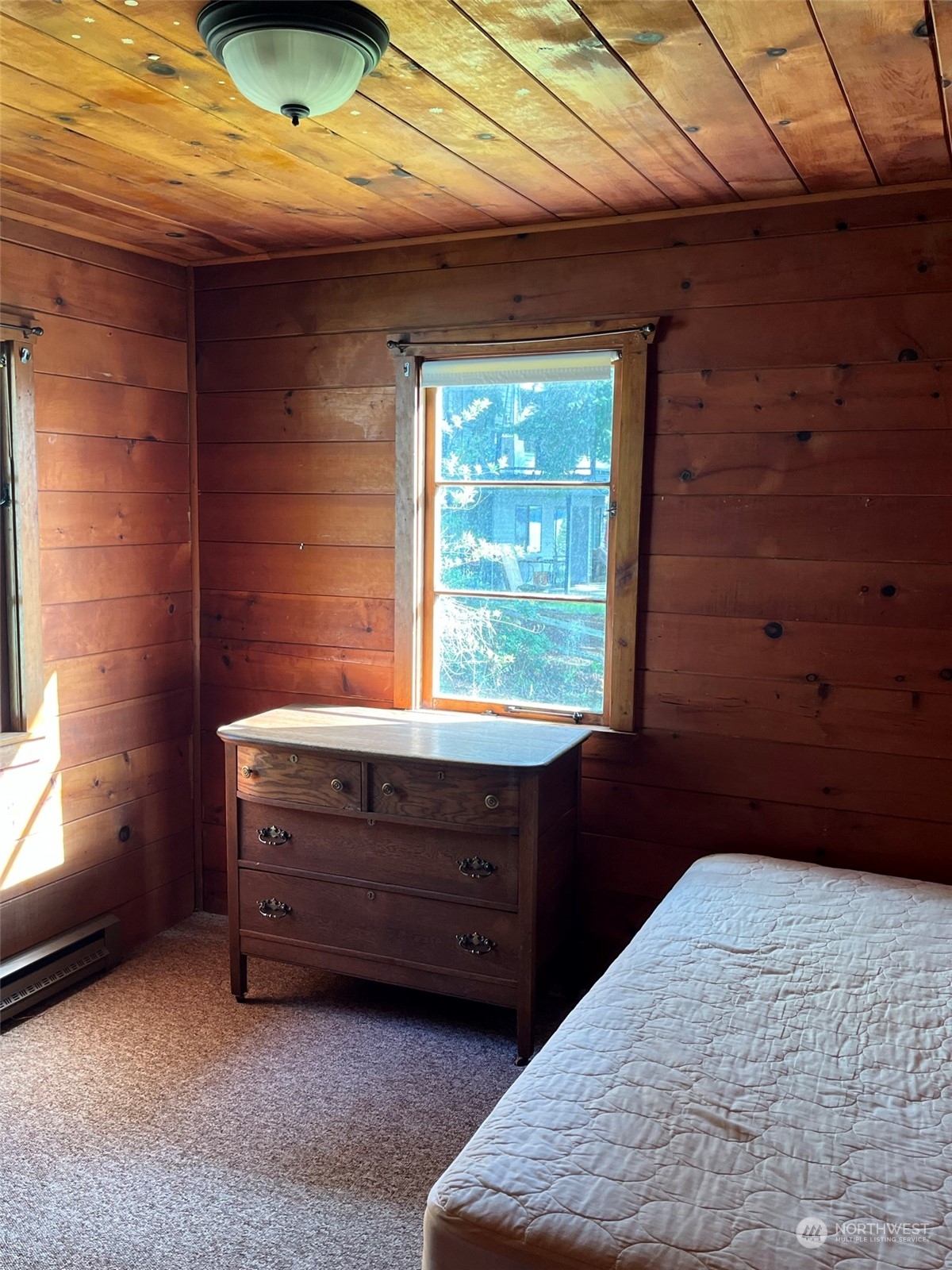 509 Spring Street Camano Island, WA 98282 - Photo 14 of 28 a room with a bed and a window