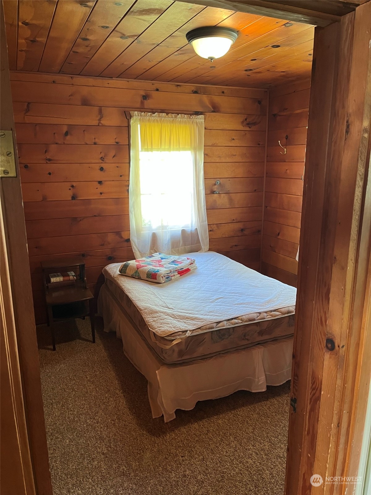 509 Spring Street Camano Island, WA 98282 - Photo 15 of 28 a bedroom with a bed and a window
