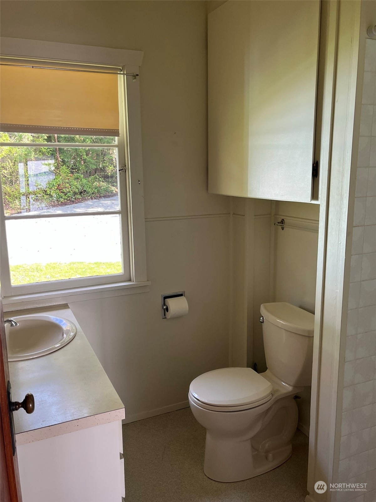 509 Spring Street Camano Island, WA 98282 - Photo 16 of 28 a bathroom with a toilet sink and mirror