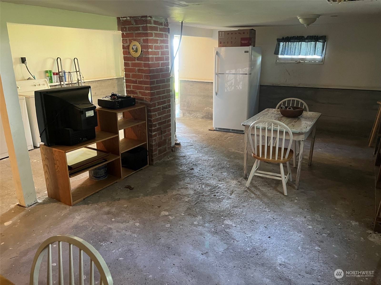 509 Spring Street Camano Island, WA 98282 - Photo 24 of 28 a dining room with furniture and a window