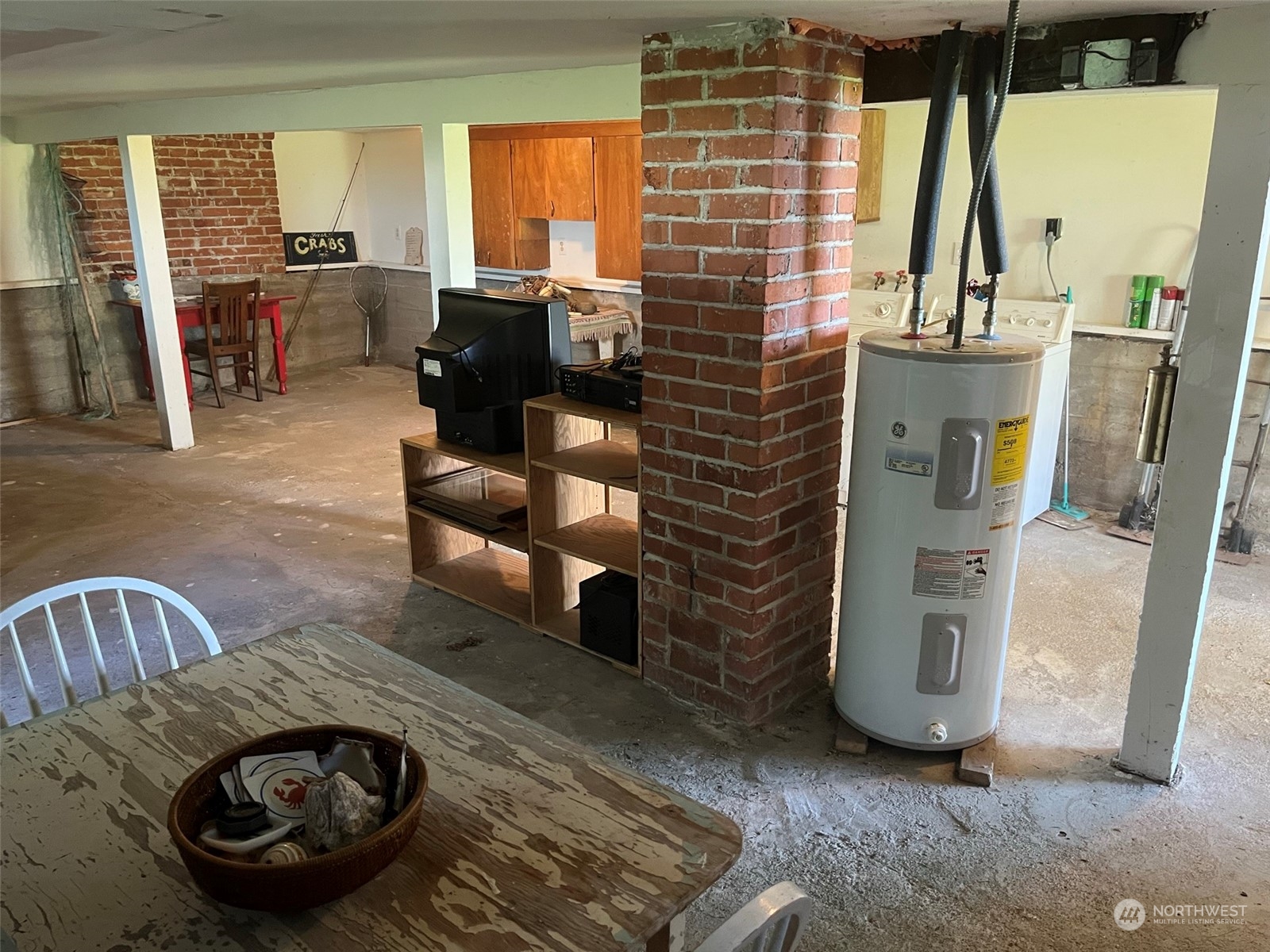 509 Spring Street Camano Island, WA 98282 - Photo 25 of 28 a living room with furniture and a floor to ceiling window