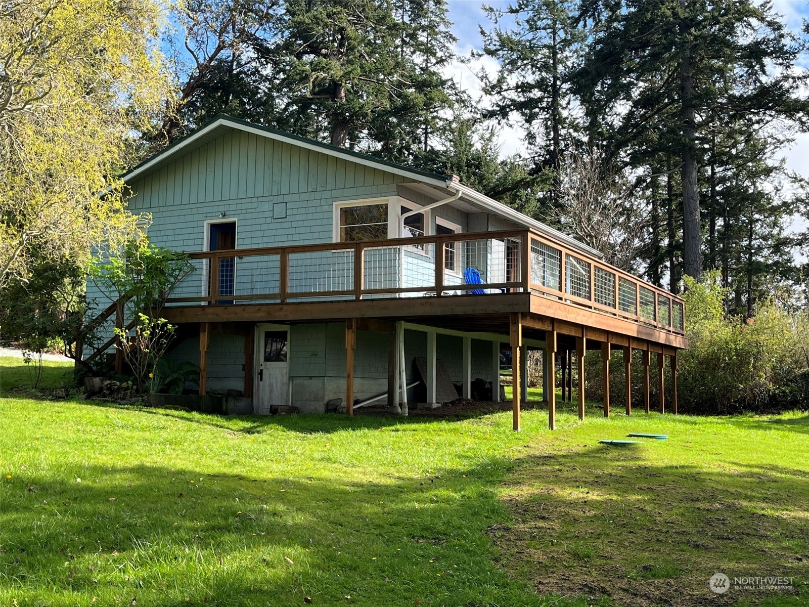 509 Spring Street Camano Island, WA 98282 - Photo 26 of 28 a view of a house with a yard