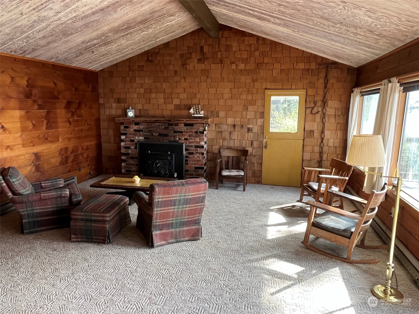 509 Spring Street Camano Island, WA 98282 - Photo 9 of 28 a living room with furniture and a fireplace