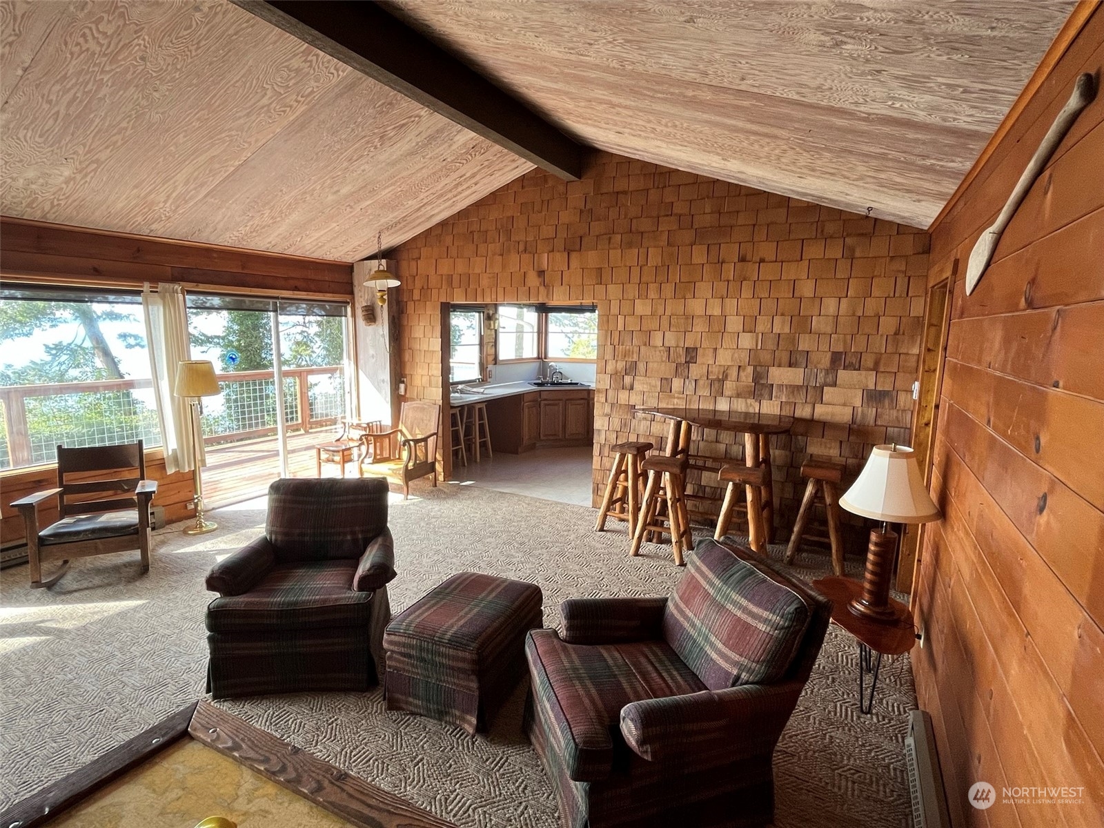 509 Spring Street Camano Island, WA 98282 - Photo 10 of 28 a living room with furniture and a large window