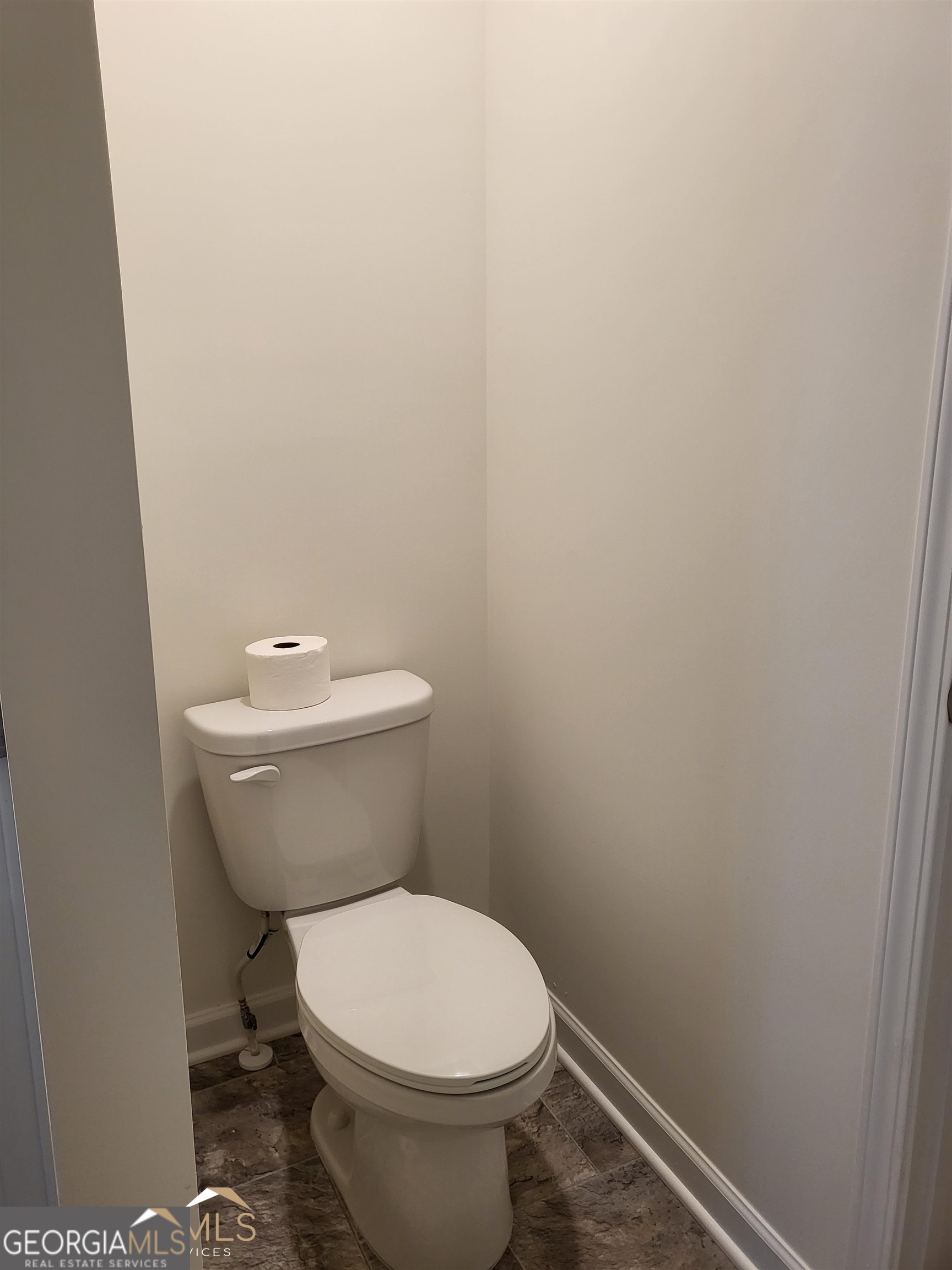839 Taurus Drive Stockbridge, GA 30281 - Photo 16 of 27 a white toilet sitting next to a white wall