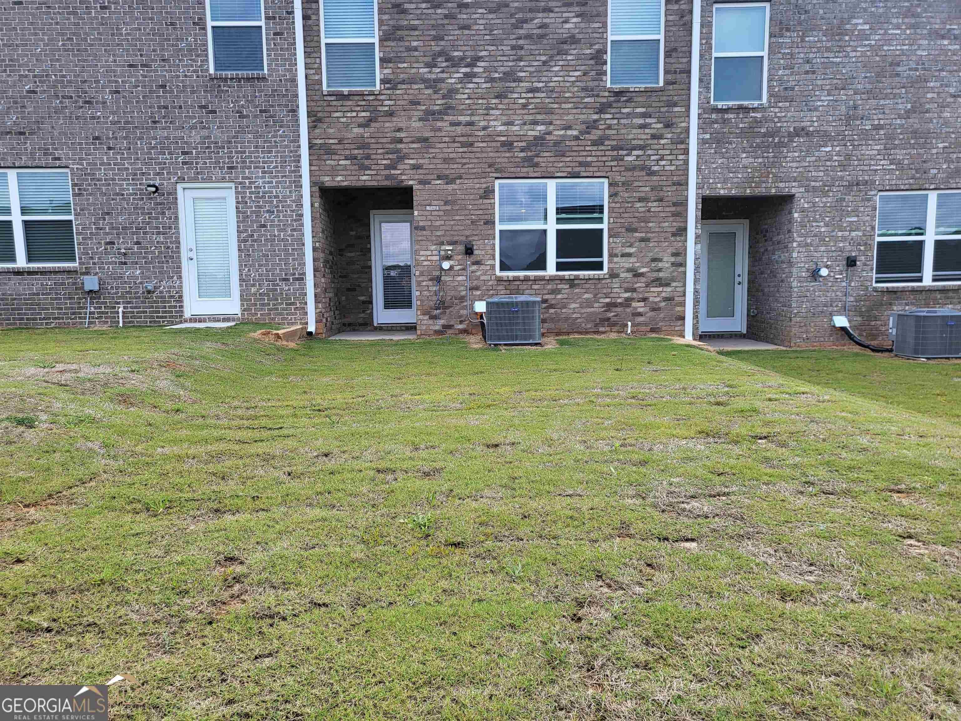 839 Taurus Drive Stockbridge, GA 30281 - Photo 27 of 27 a brick house with a yard