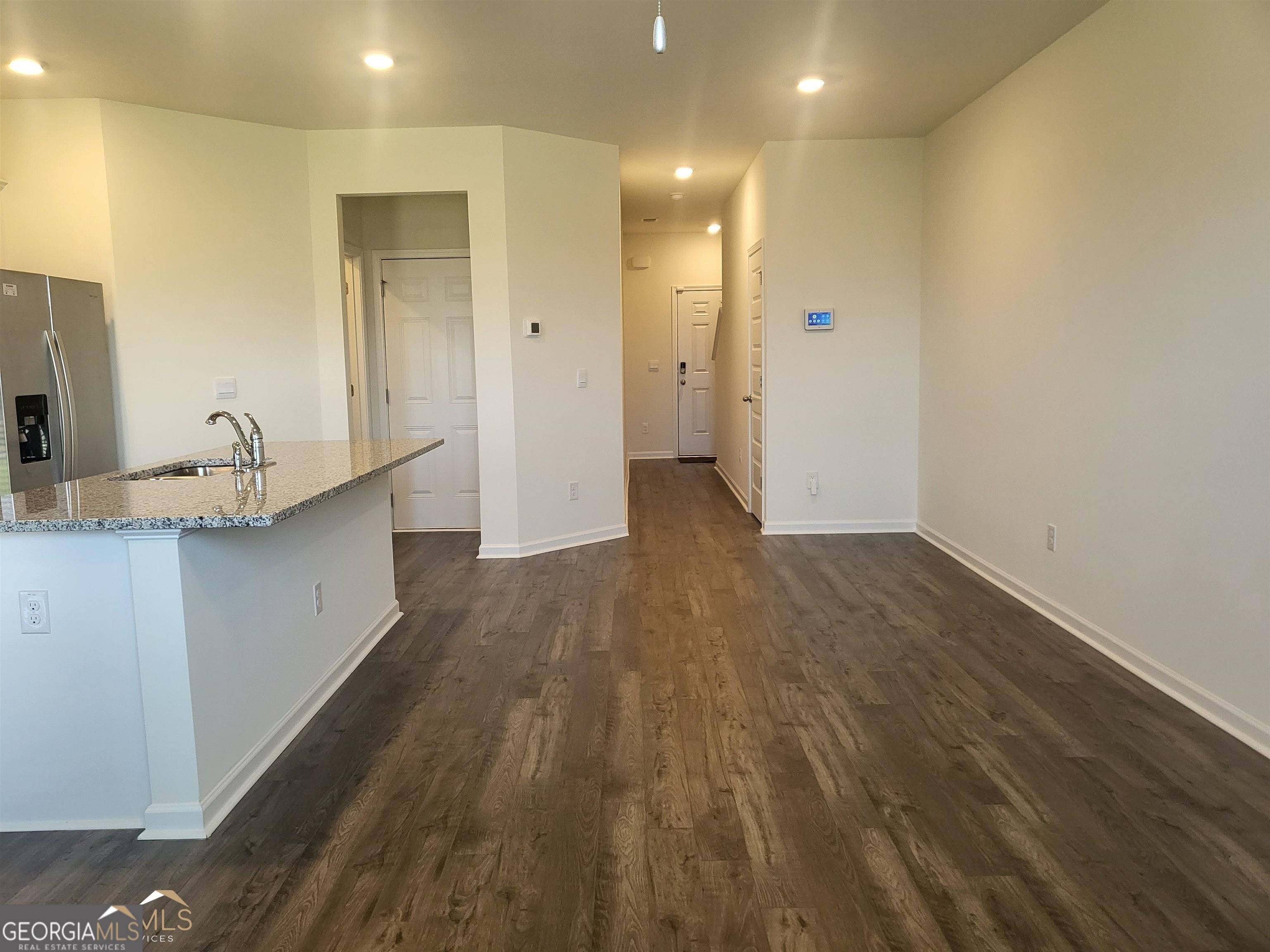 839 Taurus Drive Stockbridge, GA 30281 - Photo 6 of 27 a view of a kitchen with wooden floor and a sink