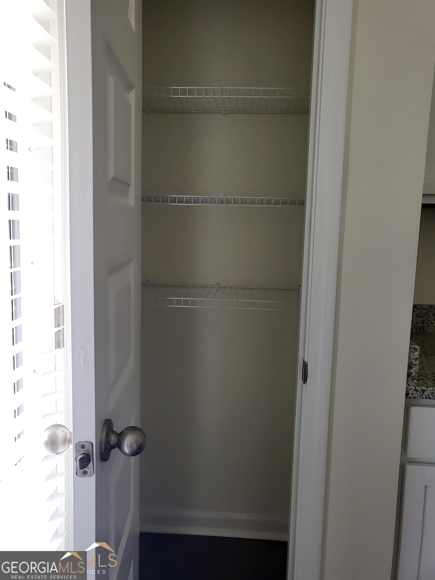 839 Taurus Drive Stockbridge, GA 30281 - Photo 7 of 27 a bathroom with a glass shower door