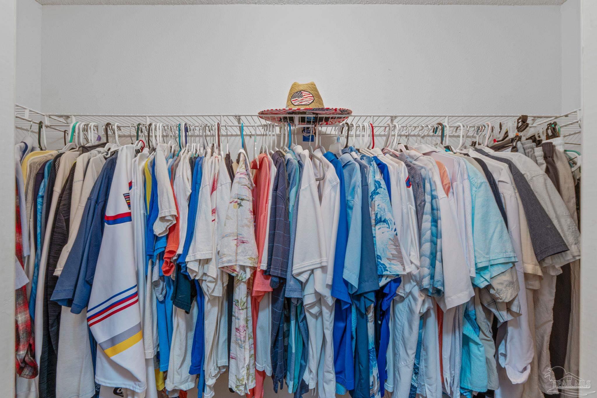1739 Ivalea Circle Navarre, FL 32566 - Photo 33 of 46 a view of walk in closet with clothes