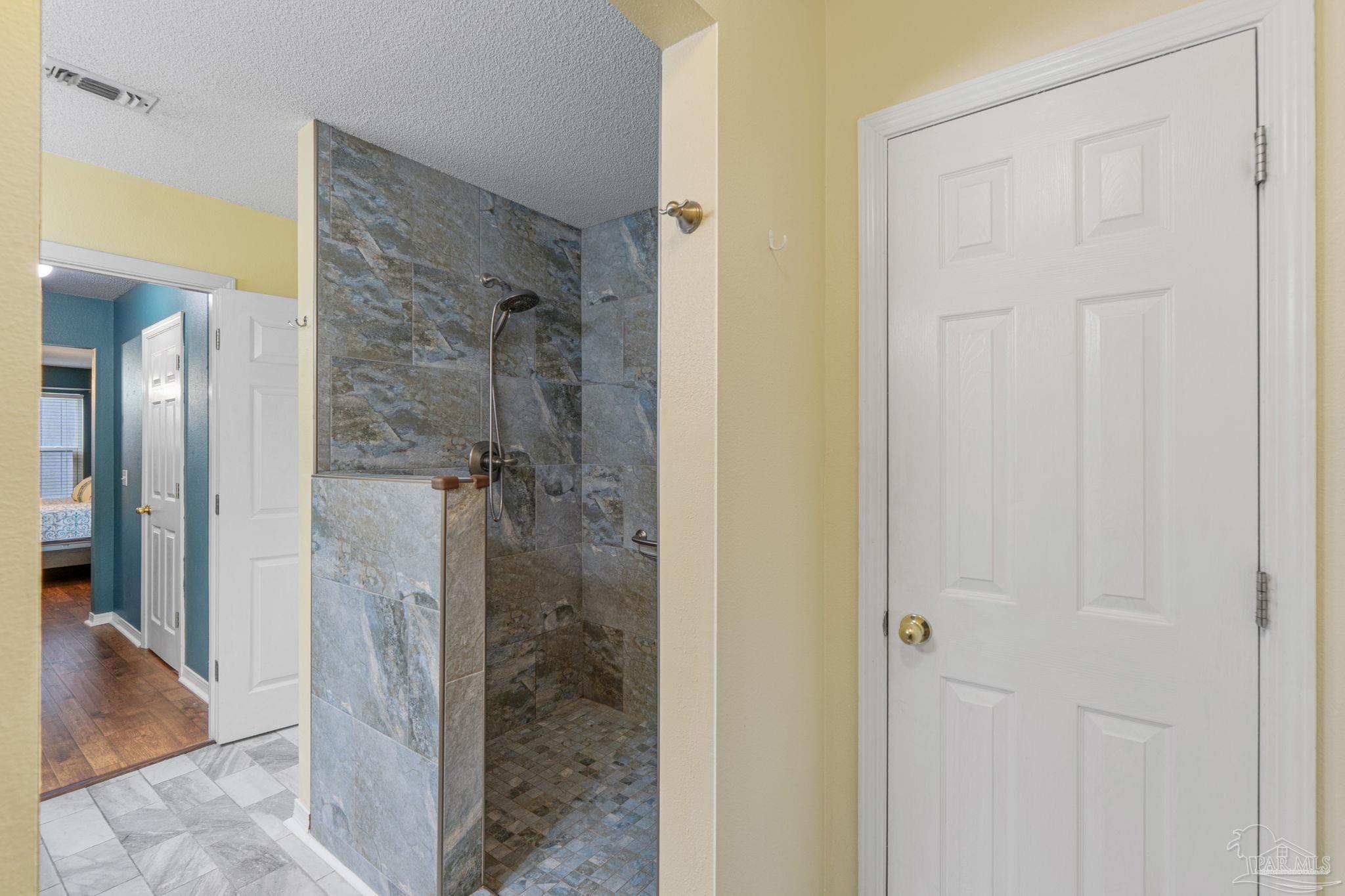 1739 Ivalea Circle Navarre, FL 32566 - Photo 37 of 46 a bathroom with a shower and a sink