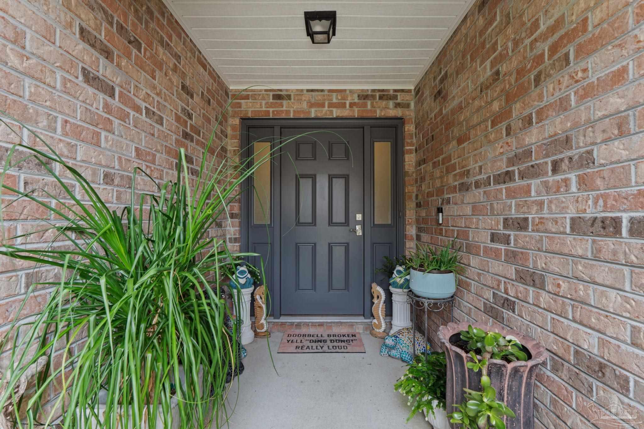 1739 Ivalea Circle Navarre, FL 32566 - Photo 6 of 46 a view of entrance door of the house