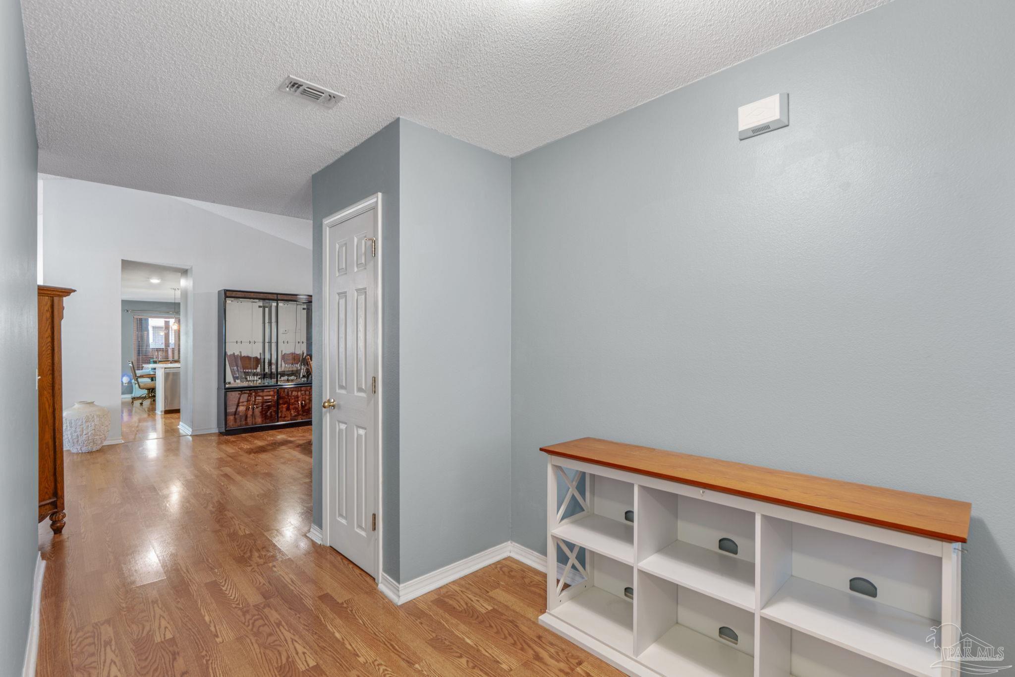 1739 Ivalea Circle Navarre, FL 32566 - Photo 8 of 46 a view of room with wooden floor