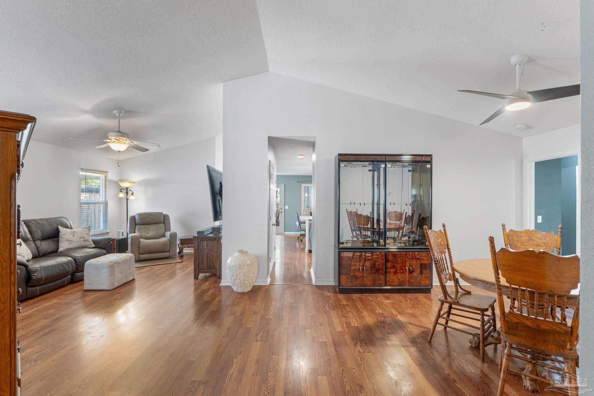 1739 Ivalea Circle Navarre, FL 32566 - Photo 9 of 46 a living room with furniture and wooden floor