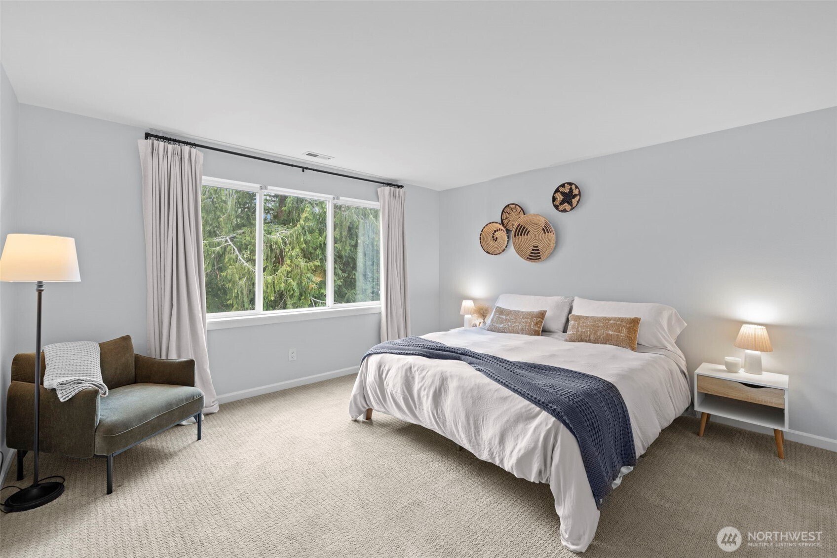 37523 Southeast Fury Street Snoqualmie, WA 98065 - Photo 14 of 30 a bedroom with a bed lamp and a large window