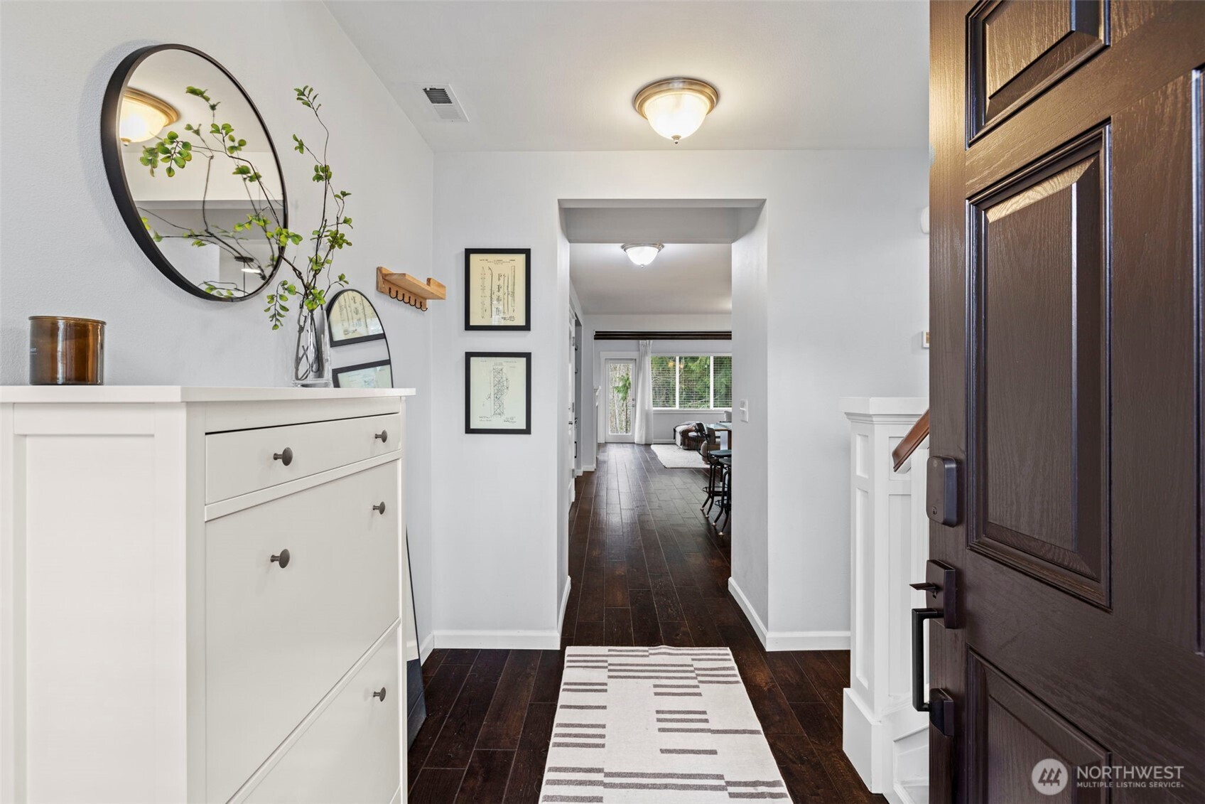 37523 Southeast Fury Street Snoqualmie, WA 98065 - Photo 2 of 30 a view of a hallway with entryway wooden floor and a rug