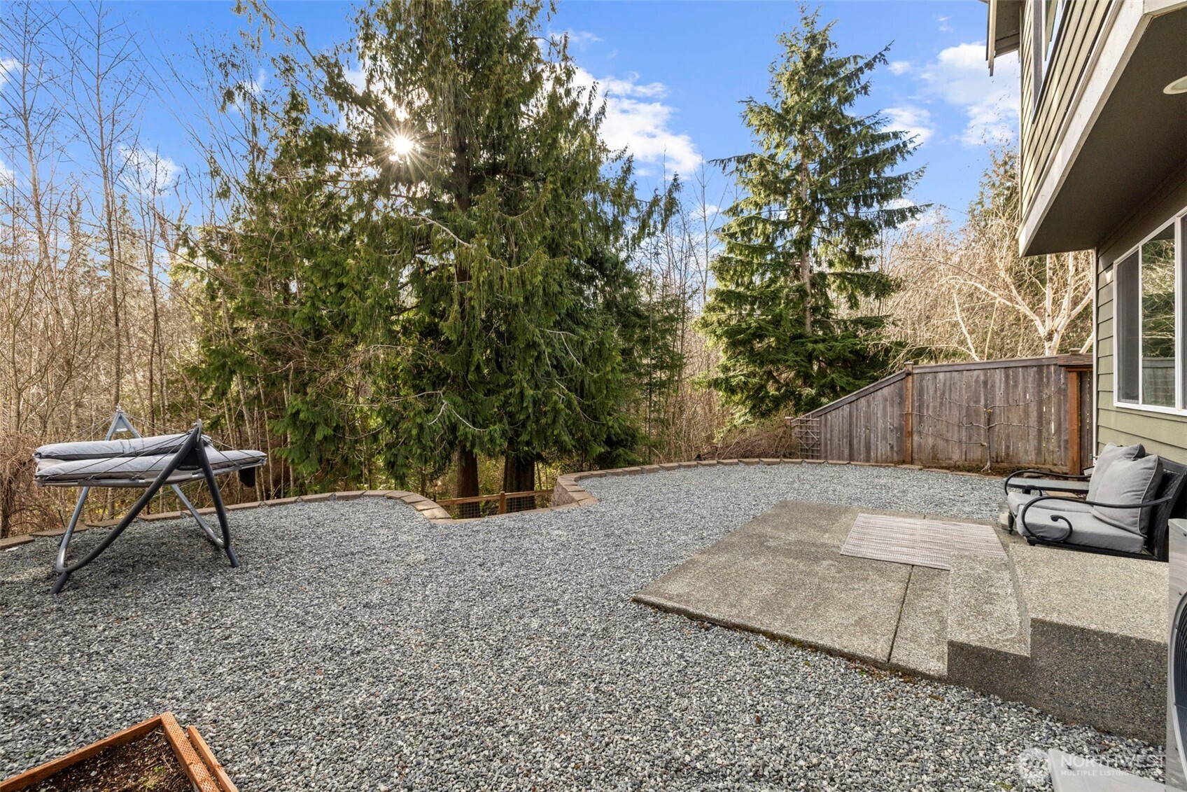 37523 Southeast Fury Street Snoqualmie, WA 98065 - Photo 23 of 30 a view of a backyard with a patio and outdoor seating