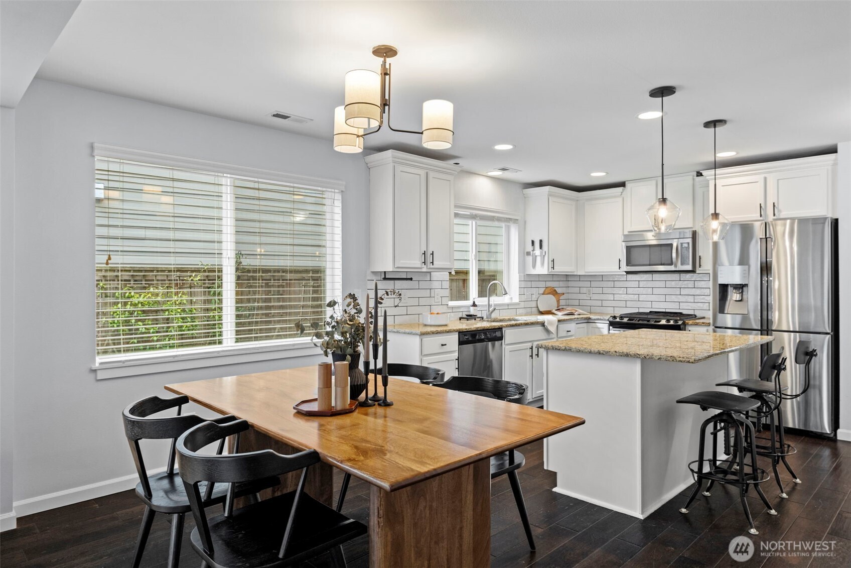 37523 Southeast Fury Street Snoqualmie, WA 98065 - Photo 7 of 30 a kitchen with a table chairs and white cabinets
