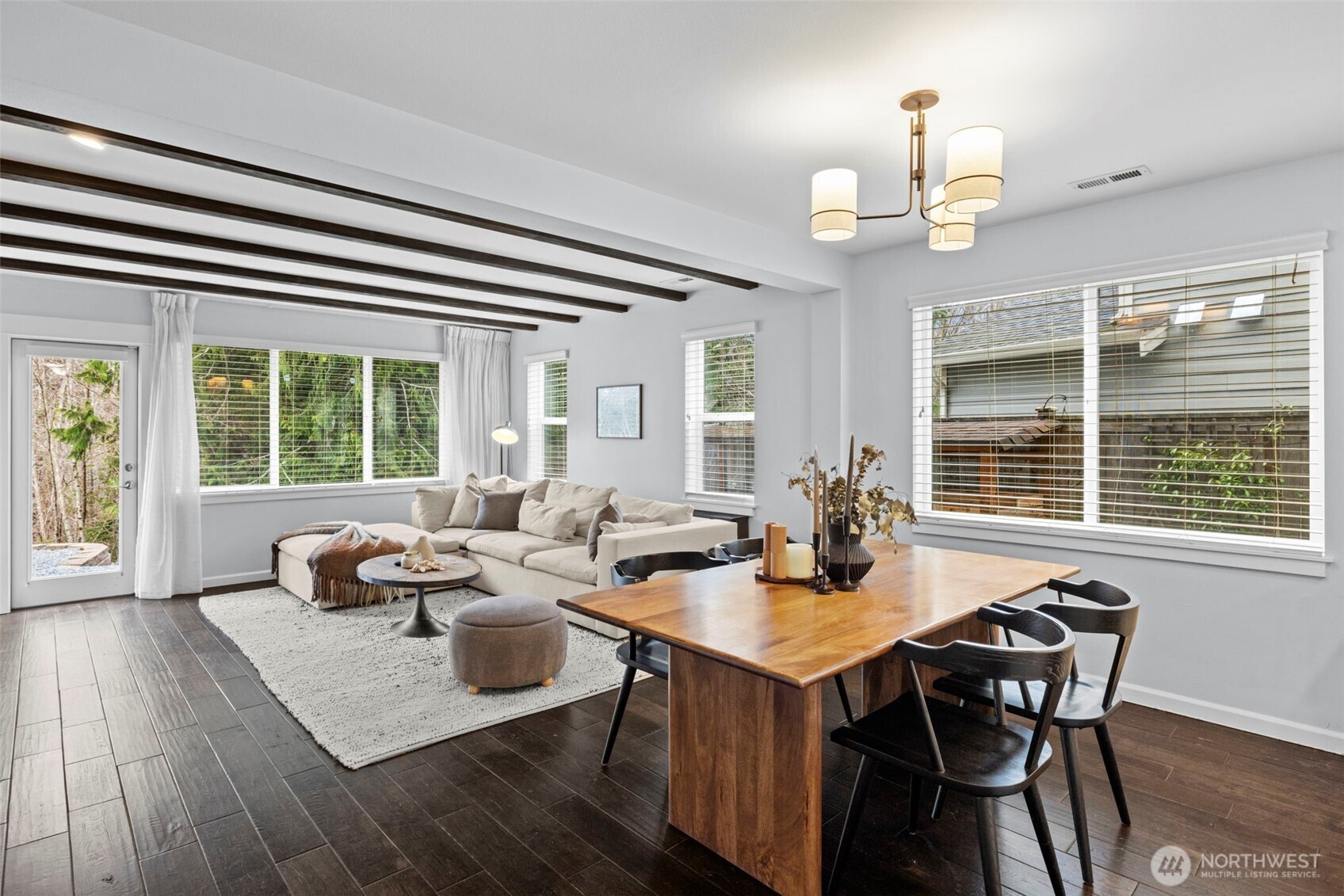37523 Southeast Fury Street Snoqualmie, WA 98065 - Photo 8 of 30 a dining room with wooden floor and large windows