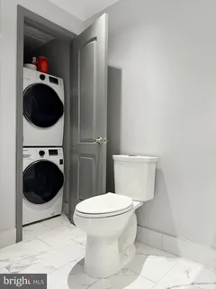 a bathroom with a toilet and a sink