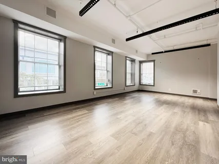 an empty room with windows