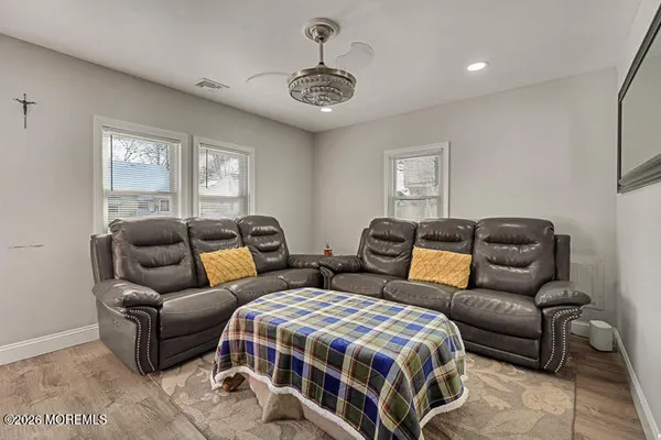 a spacious bedroom with two beds and a couch