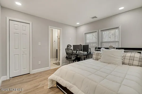 a bed room with a bed and dresser