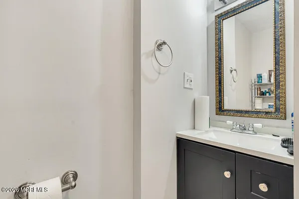 a bathroom with a double vanity sink and a mirror