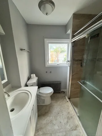 a bathroom with a sink and toilet