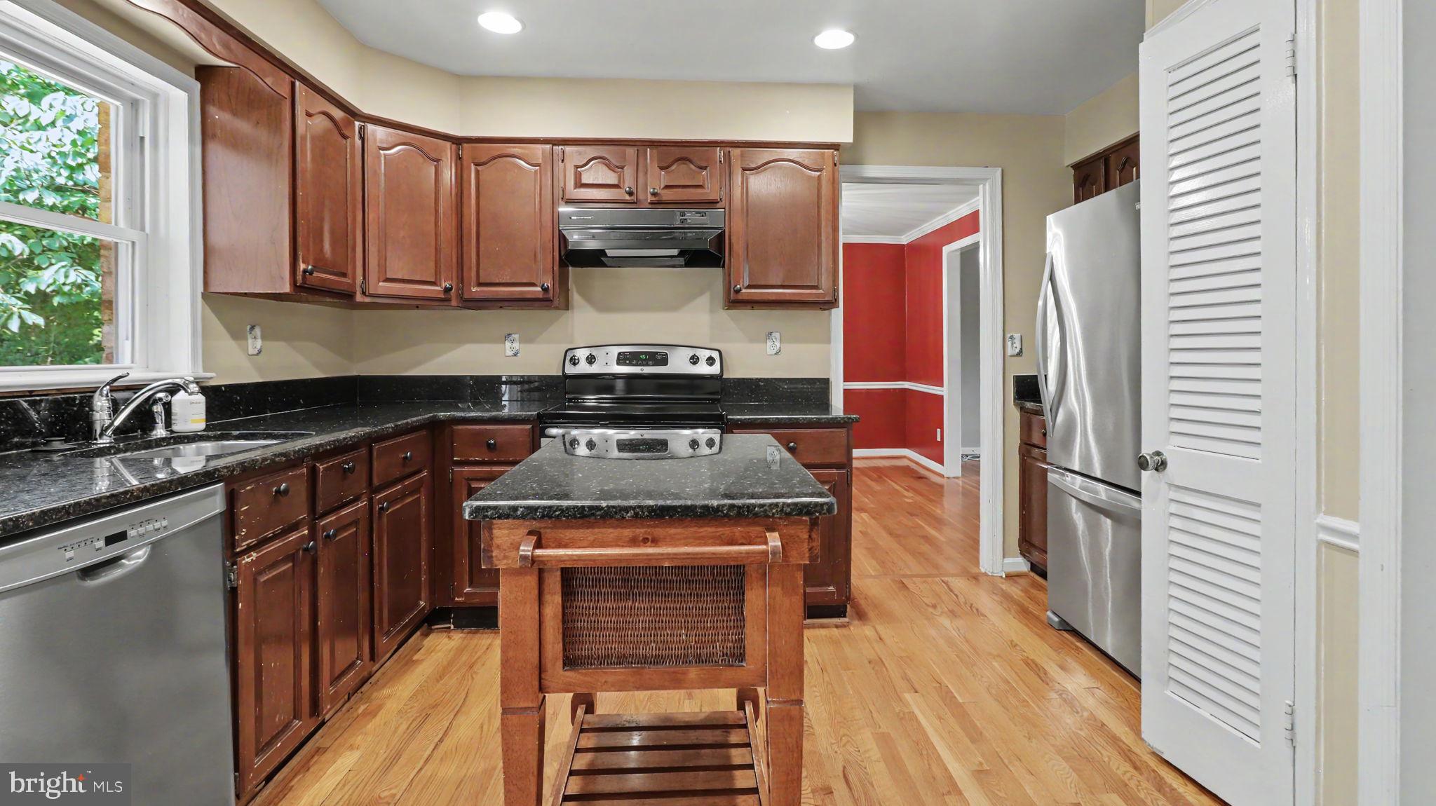 6770 Baron Road McLean, VA 22101 - Photo 24 of 81 Modern kitchen with rich wood accents.