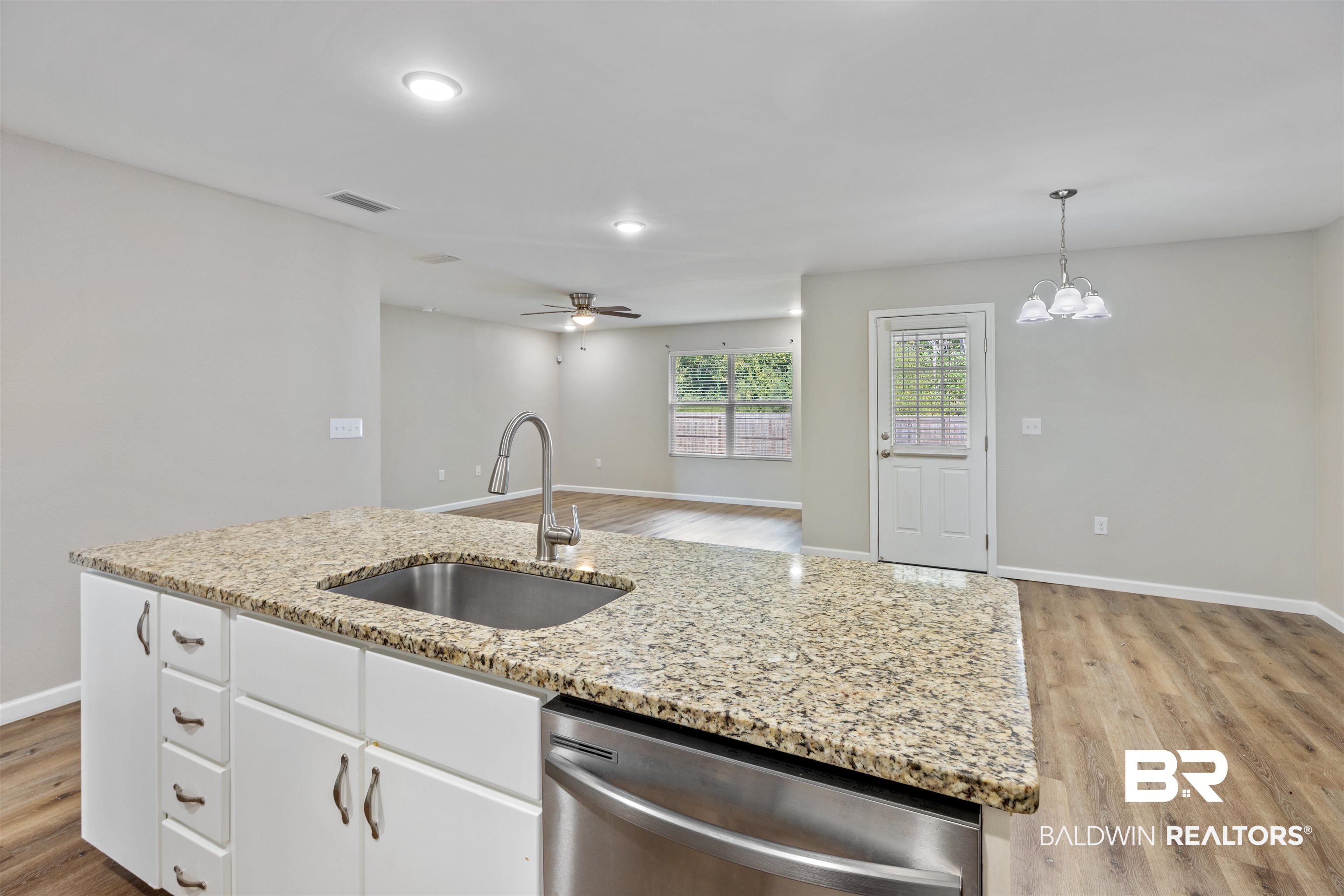 7456 Coppin Drive Foley, AL 36535 - Photo 7 of 32 Kitchen overlooks dining & living areas