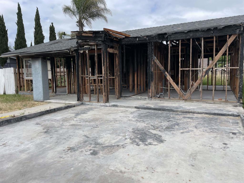 a view of a house with wooden floor and a chair