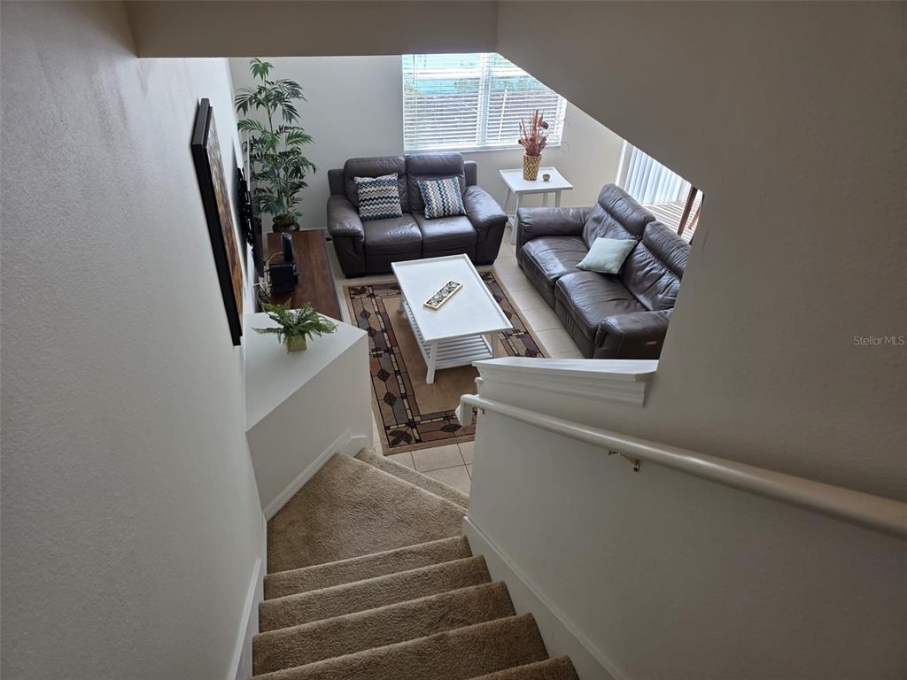 5160 Ambergris Loop Kissimmee, FL 34746 - Photo 19 of 38 a view of entryway and hall with wooden floor