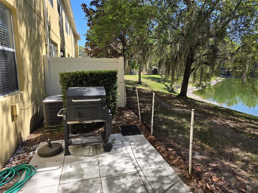 5160 Ambergris Loop Kissimmee, FL 34746 - Photo 35 of 38 a backyard of a house with seating space