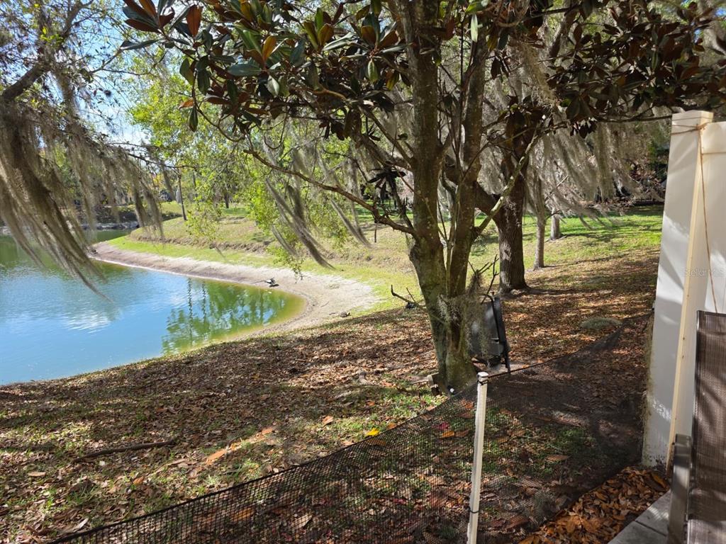 5160 Ambergris Loop Kissimmee, FL 34746 - Photo 37 of 38 a view of a yard with wooden fence