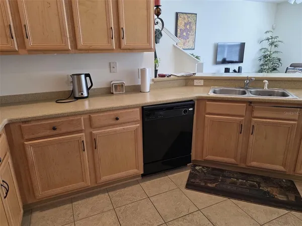 a kitchen with a sink and cabinets