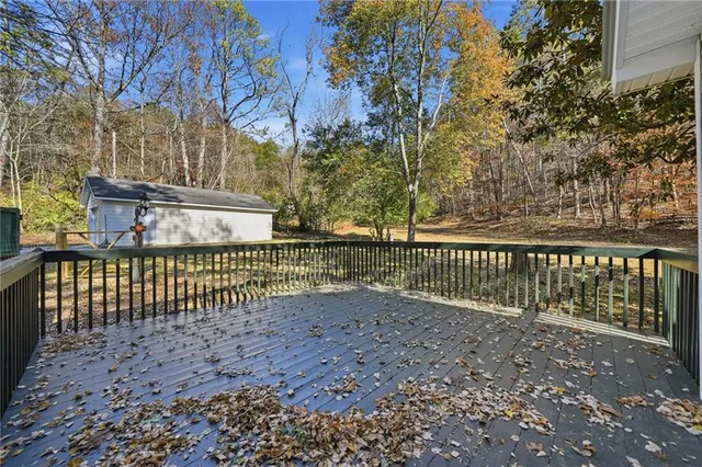 a view of a fence and trees